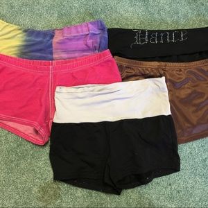Five dance shorts in size adult small